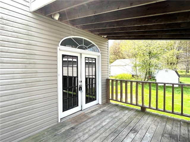 420 Church St, Harrisville Boro, PA 16038 - wooden deck featuring french doors, an outdoor structure, a yard, and a shed