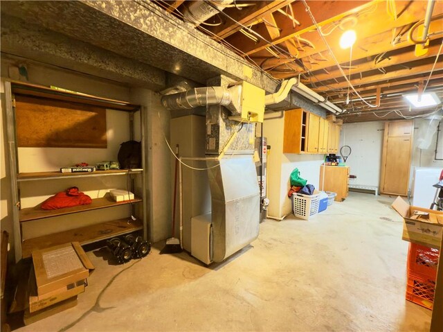 unfinished basement featuring heating unit