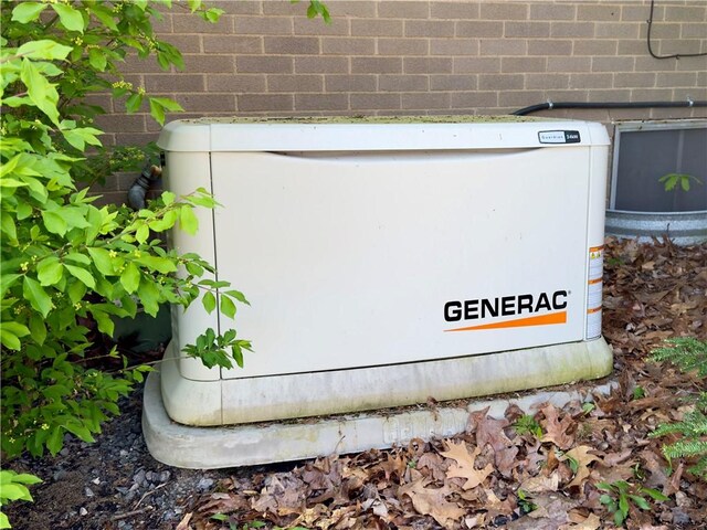 exterior details with brick siding and a power unit