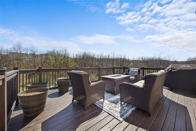 wooden deck featuring a fire pit