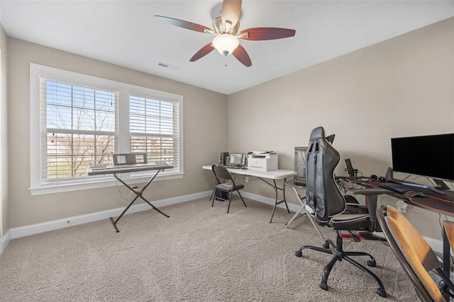 home office featuring baseboards, ceiling fan, carpet, and visible vents