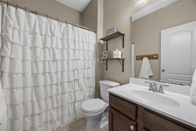 full bathroom featuring toilet, curtained shower, tile patterned flooring, and vanity