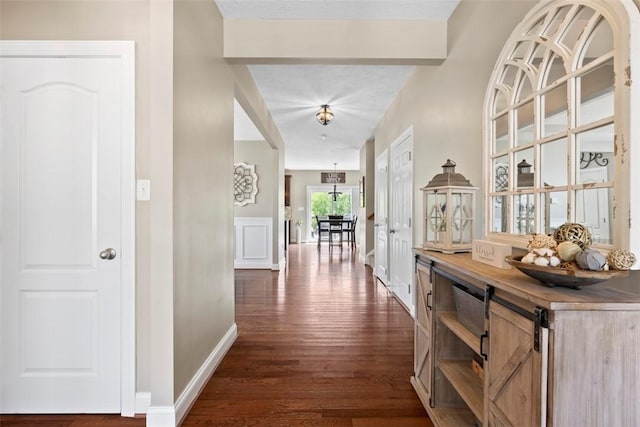 118 General Ct, Lehigh Twp, PA 16063 - hallway featuring dark wood-style flooring, baseboards, and a chandelier