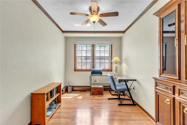office featuring baseboards, ceiling fan, ornamental molding, and light wood-style flooring