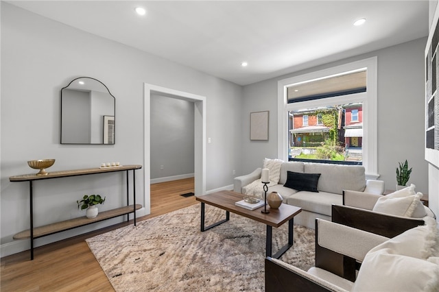7314 Monticello St, Homewood-Brushton, PA 15208 - living area featuring baseboards, recessed lighting, wood finished floors, and visible vents
