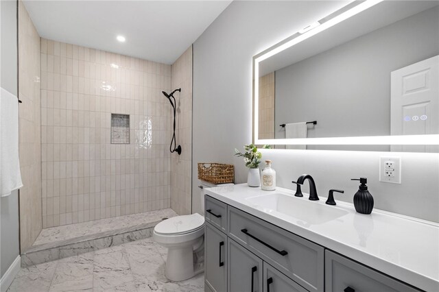 7314 Monticello St, Homewood-Brushton, PA 15208 - bathroom featuring a tile shower, vanity, toilet, marble finish floor, and recessed lighting