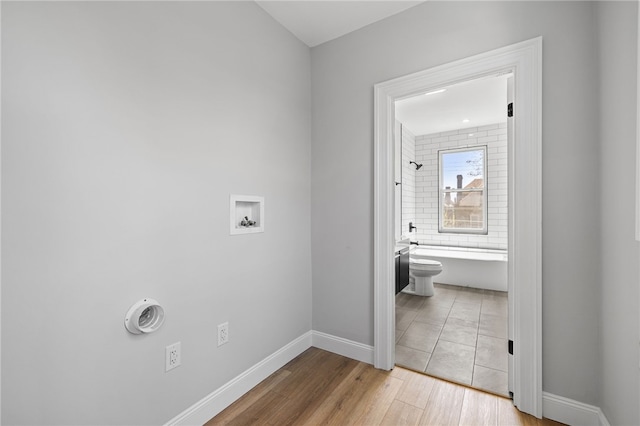 7314 Monticello St, Homewood-Brushton, PA 15208 - laundry room with washer hookup, baseboards, laundry area, and wood finished floors