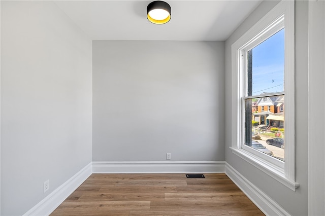 7314 Monticello St, Homewood-Brushton, PA 15208 - empty room featuring baseboards, visible vents, and wood finished floors