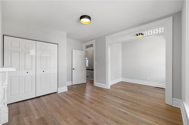 7314 Monticello St, Homewood-Brushton, PA 15208 - unfurnished bedroom with light wood-style floors, baseboards, visible vents, and a closet