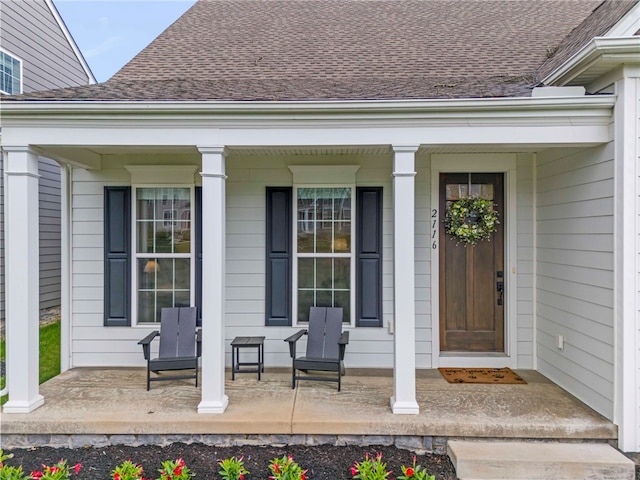 doorway to property featuring covered porch