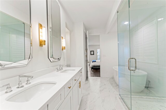 full bathroom with a sink, a soaking tub, double vanity, and marble finish floor