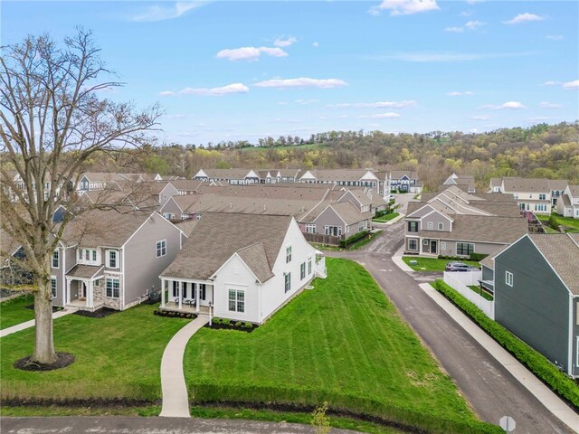 birds eye view of property with a residential view