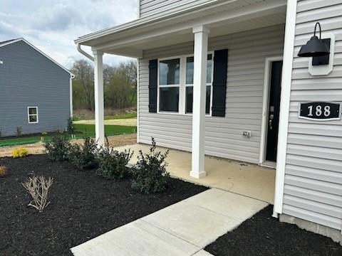 property entrance featuring a porch