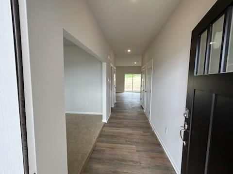 hall with recessed lighting, baseboards, and wood finished floors