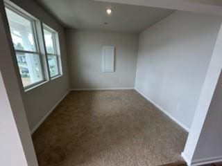 carpeted empty room featuring recessed lighting and baseboards