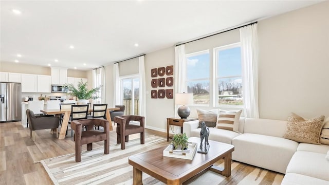 living room featuring recessed lighting and light wood finished floors