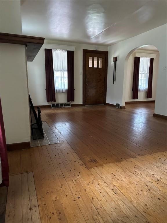 11 N Grandview Ave, Crafton, PA 15205 - foyer with arched walkways, wood-type flooring, plenty of natural light, and baseboards