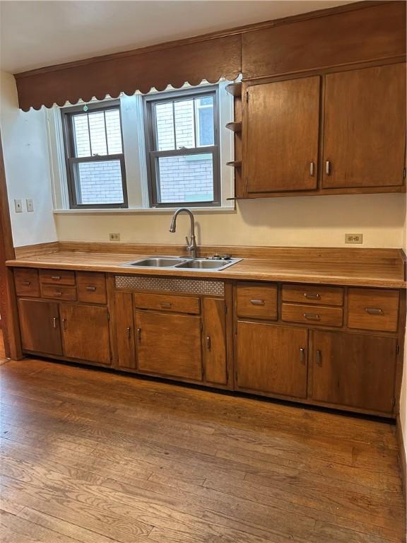 11 N Grandview Ave, Crafton, PA 15205 - kitchen featuring a sink, wood finished floors, brown cabinets, light countertops, and open shelves