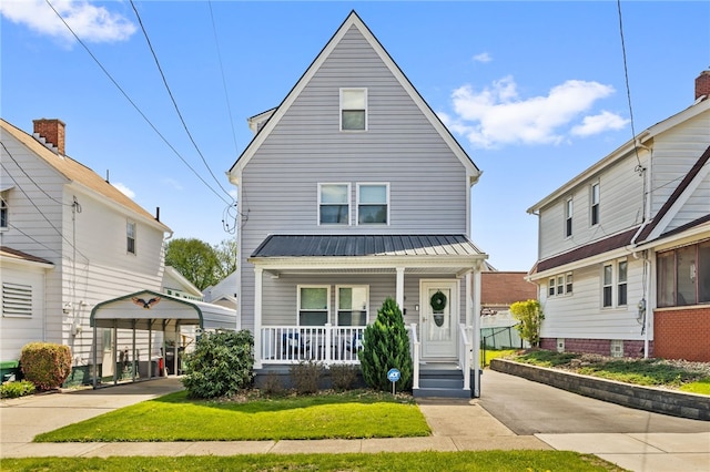 1629 Davidson St, Aliquippa, PA 15001 - view of front facade featuring a porch, metal roof, and a carport