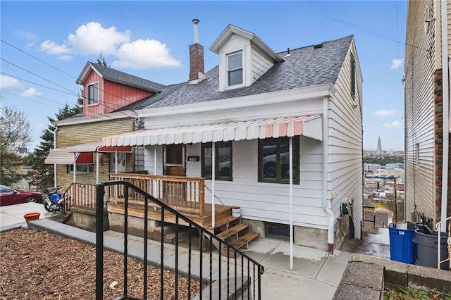 2715 Mission St, South Side, PA 15203 - cape cod home featuring a shingled roof and a chimney