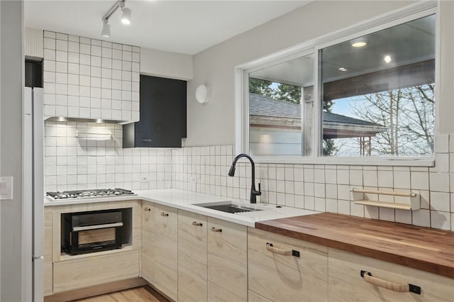 2715 Mission St, South Side, PA 15203 - kitchen with gas cooktop, backsplash, a sink, butcher block counters, and oven