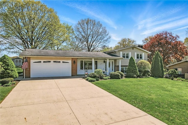 3640 Ridgewood Dr, Hermitage, PA 16148 - split level home with a garage, concrete driveway, a front lawn, and brick siding