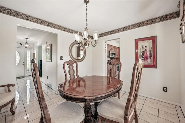 3640 Ridgewood Dr, Hermitage, PA 16148 - dining space featuring light tile patterned flooring, baseboards, and a notable chandelier