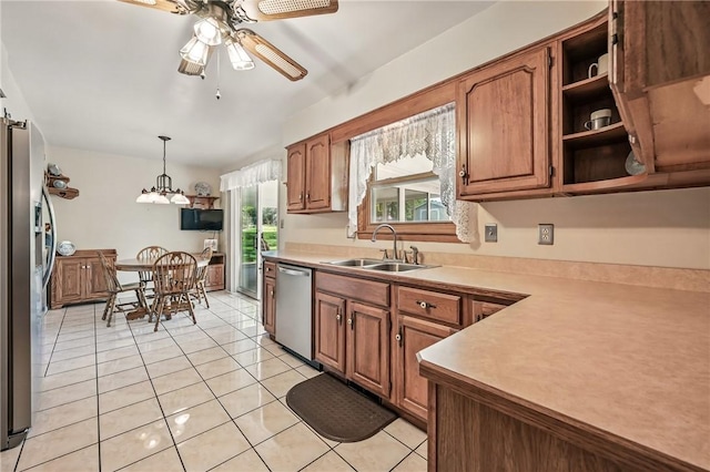 3640 Ridgewood Dr, Hermitage, PA 16148 - kitchen featuring a sink, appliances with stainless steel finishes, ceiling fan, and brown cabinets
