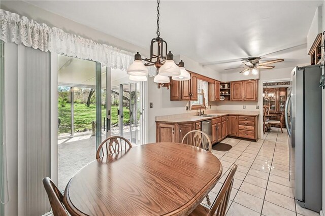 3640 Ridgewood Dr, Hermitage, PA 16148 - dining space featuring ceiling fan with notable chandelier and light tile patterned flooring
