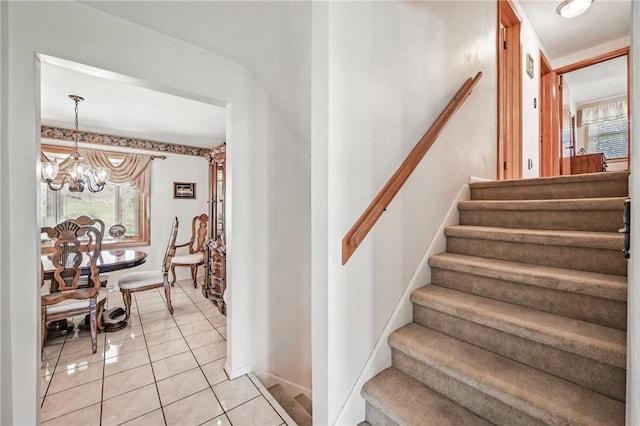 3640 Ridgewood Dr, Hermitage, PA 16148 - staircase with an inviting chandelier, baseboards, and tile patterned flooring