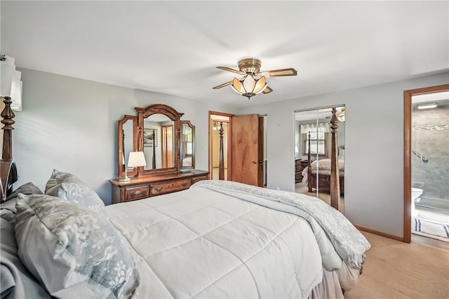 3640 Ridgewood Dr, Hermitage, PA 16148 - bedroom with a closet, light carpet, baseboards, ensuite bathroom, and ceiling fan