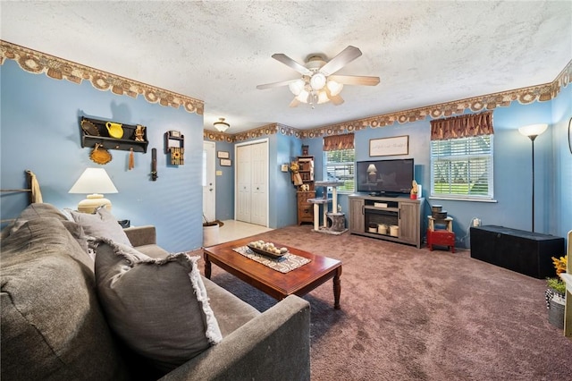 carpeted living room featuring a ceiling fan and a textured ceiling