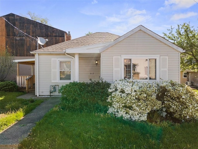 bungalow-style home with a chimney