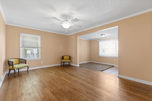 unfurnished room with ceiling fan, baseboards, and hardwood / wood-style flooring