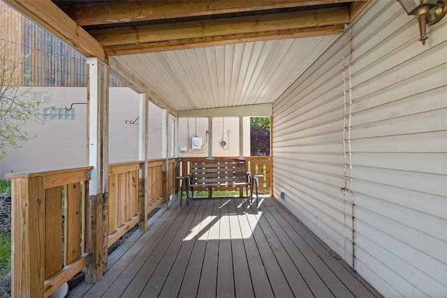 wooden terrace featuring covered porch