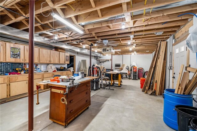 unfinished basement with a workshop area