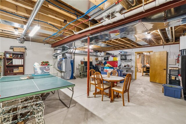 unfinished basement featuring heating unit