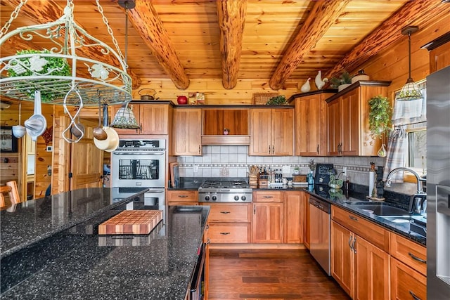 kitchen featuring appliances with stainless steel finishes, brown cabinets, a sink, wooden ceiling, and dark wood-style floors