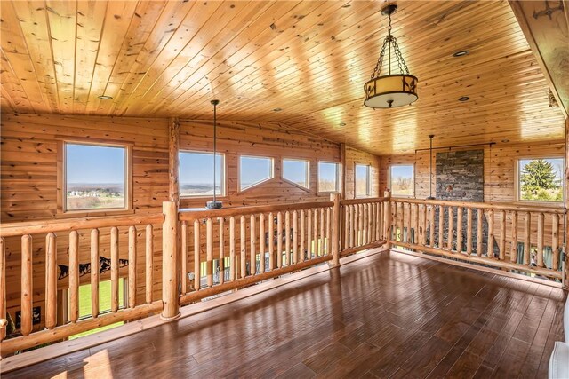 interior space with wood ceiling, vaulted ceiling, and hardwood / wood-style floors