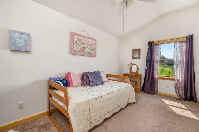 bedroom featuring baseboards, ceiling fan, carpet, and lofted ceiling