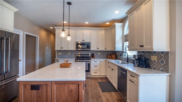 107 Skyview Dr, Buffalo Twp But, PA 16055 - kitchen featuring light stone counters, a sink, stainless steel appliances, dark wood-type flooring, and a kitchen island
