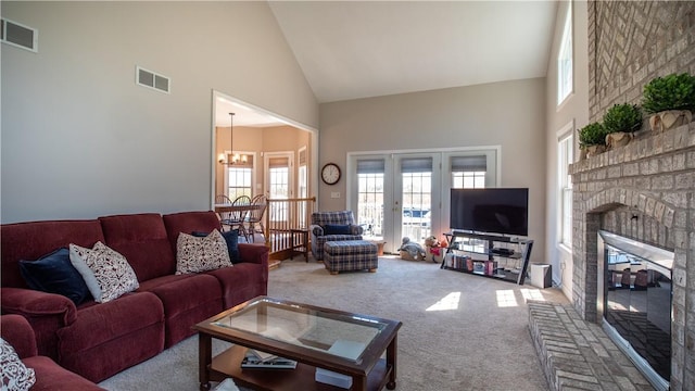 107 Skyview Dr, Buffalo Twp But, PA 16055 - living room featuring visible vents, carpet flooring, a fireplace, and high vaulted ceiling