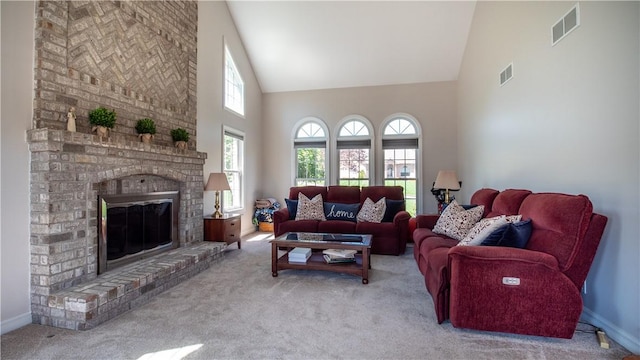 107 Skyview Dr, Buffalo Twp But, PA 16055 - carpeted living room featuring high vaulted ceiling, visible vents, baseboards, and a fireplace