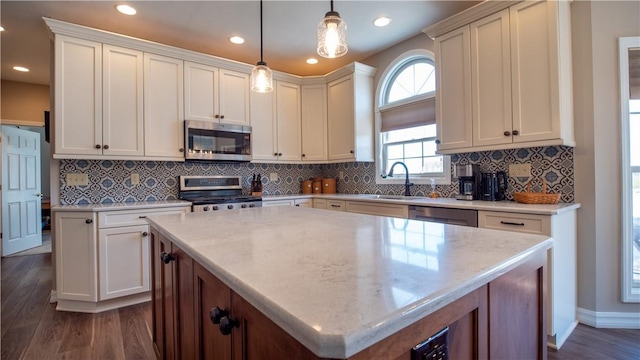 107 Skyview Dr, Buffalo Twp But, PA 16055 - kitchen with appliances with stainless steel finishes, dark wood-style floors, a sink, recessed lighting, and pendant lighting