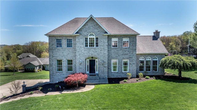 107 Skyview Dr, Buffalo Twp But, PA 16055 - view of front facade with a chimney, a front lawn, and brick siding