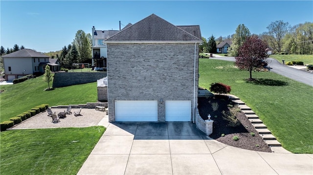 107 Skyview Dr, Buffalo Twp But, PA 16055 - exterior space with driveway, a lawn, brick siding, an attached garage, and a shingled roof