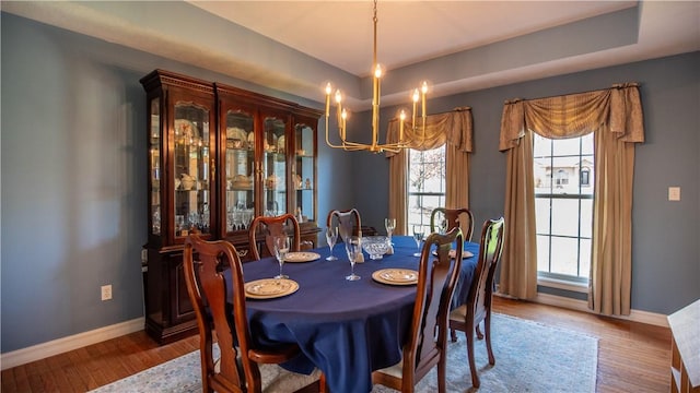 107 Skyview Dr, Buffalo Twp But, PA 16055 - dining area featuring baseboards, plenty of natural light, wood finished floors, and a chandelier