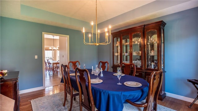 107 Skyview Dr, Buffalo Twp But, PA 16055 - dining area featuring an inviting chandelier, baseboards, and wood finished floors