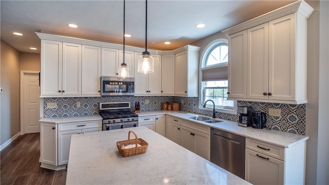 107 Skyview Dr, Buffalo Twp But, PA 16055 - kitchen with dark wood-style floors, a sink, stainless steel appliances, recessed lighting, and pendant lighting