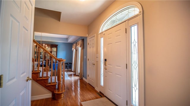 107 Skyview Dr, Buffalo Twp But, PA 16055 - foyer entrance with baseboards, stairs, and hardwood / wood-style floors